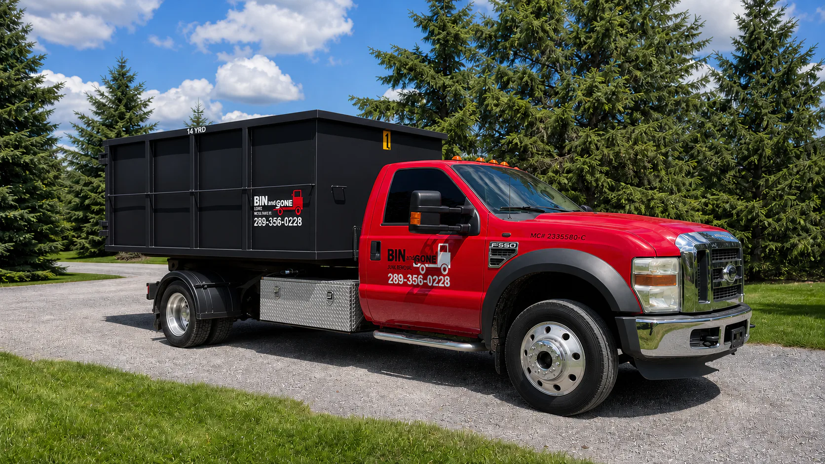 Bin and Gone's red delivery truck carrying a black rental bin